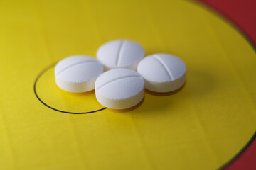 Close up of medicine or drugs on yellow background
