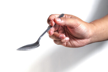 hand holding spoon
