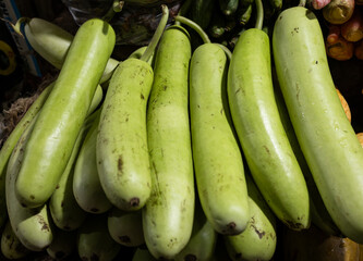 Raw Green Organic bottle gourd fresh vegetables at retail store for sale at evening