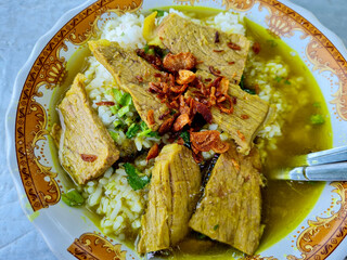 Soto Daging. Indonesian Food in a bowl.  Traditional Beef in a Clear Soup