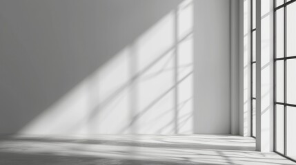 Obraz premium Minimalist Light and Shadow: The play of light and shadow dances gracefully across the stark, clean surfaces of a modern, minimalist interior. Captured during the day.