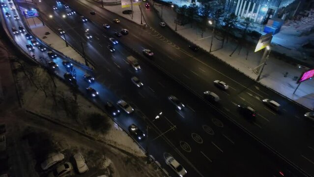 Leningradskoe highway with transport traffic near edifice of VTB company