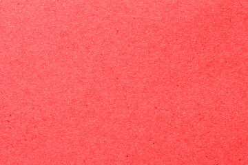 red paper background texture light rough textured spotted blank copy space background in red , pink