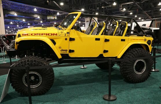 Philadelphia, Pennsylvania, U.S.A - January 14, 2024 - The side view of the yellow color of 2018 Jeep Wrangler JLU Rubicon 4 door 4X4
