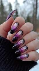 A shimmering purple hand adorned with glossy nails, a fashion statement that glitters under the outdoor light