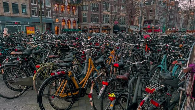 Traditional old narrow houses boats and canals in Amsterdam, Netherlands, Europe, January 20, 2024. High quality 4k footage