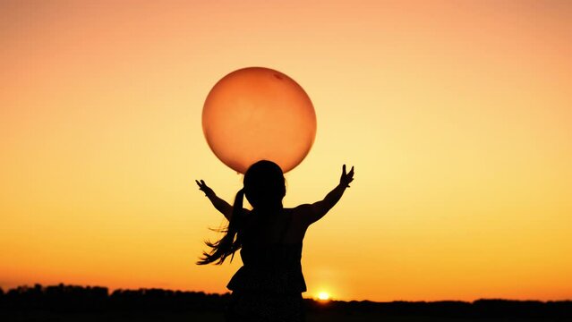 little girl daughter holding balloon sunset, childhood dream flying sky, happy family, little girl holding ball sunset, journey exploration imagination, dream flying little girl holding balloon