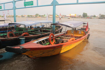 A wooden ship for transporting goods waiting for its cargo