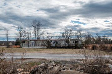 Abandoned trailer across a road in Shelby, North Carolina.