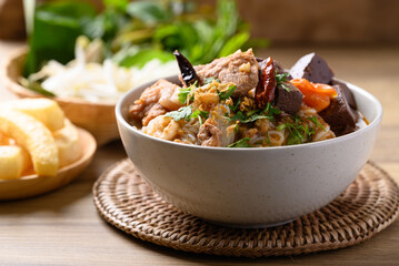 Northern Thai food (Kanom Jeen Nam Ngeaw), Spicy rice noodles soup with pork and pork blood eating with fresh vegetables