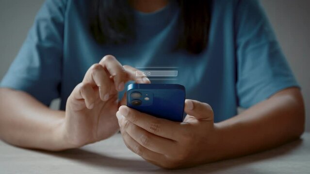 Woman using smartphone sends and receives email