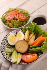 Selat Solo is a typical dish of Solo, Central Java, made from processed beef, fresh vegetables, eggs, french fries, boiled carrots. served with meat broth and mayonnaise sauce. Indonesian food. 