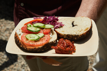 Bagel and cream cheese with tomato and cucumber
