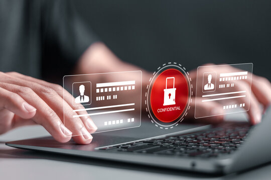 Employee confidentiality concept. Person use laptop with virtual padlock icon with confidential word to access documents data and cyber security for managing corporate files and employee information.
