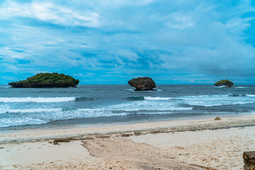 A hidden beach that is still very empty of tourists in Pacitan district, East Java province, Indonesia, which has white sand and charming waves. The beach with a very beautiful view in the morning