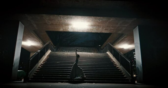 Night, stairs and dancing with woman, balance and wellness with routine, training and performance. Dancer, person and artist with practice, evening and freedom with talent, creativity and ballet