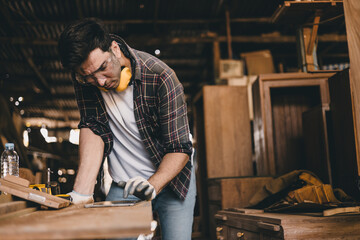 professional carpenter man hand working make wooden handcraft furniture master workpiece fine detail artisan with wood workshop.