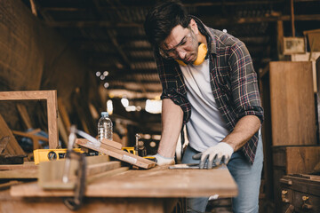 professional carpenter man hand working make wooden handcraft furniture master workpiece fine detail artisan with wood workshop.