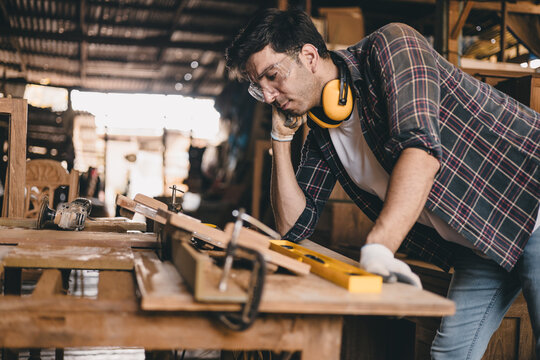 professional carpenter man hand working make wooden handcraft furniture master workpiece fine detail artisan with wood workshop.