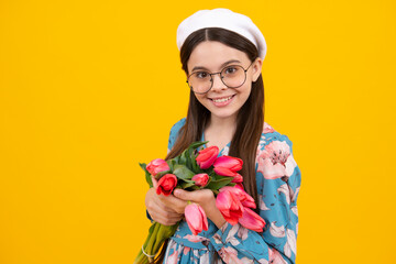 Floral present. Happy child hold tulips. Girl with bouquet of tulips, congratulates happy surprised girl, copy space. Celebration holiday, birthday and mother day.