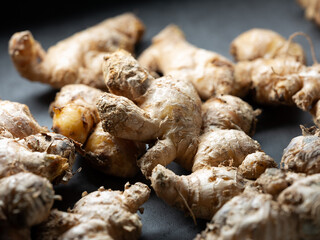 Fresh ginger on dark background