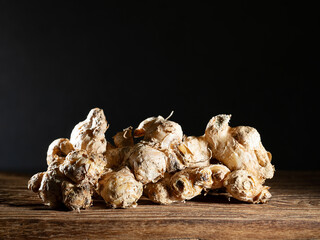 Fresh ginger on dark background	