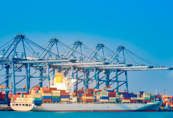 Port transports containers with crane Board a ship to deliver large cargo. Shipping system by sea, shipping containers.concept international transportation Export-import business, logistics
