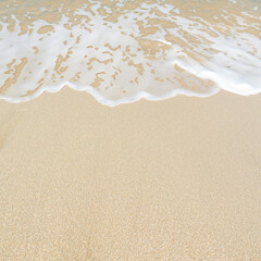 Soft ocean wave on the sandy beach, background.