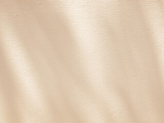 Abstract shadow and light on beige wall, abstract background for product design presentation.