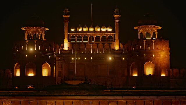 red fort in delhi india at night with lights and camera lens flares, stable shot 4k