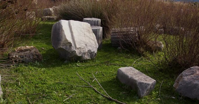 Ancient stones in grass in Miletus.