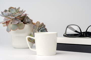 Coffee mug on white office table mock up