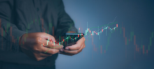 Businessman using smartphone trading forex stock market.Business financial data.