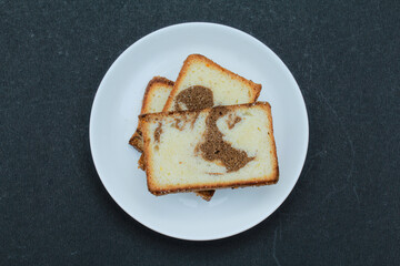 Chocobar Cakes in a plate on black background top view 