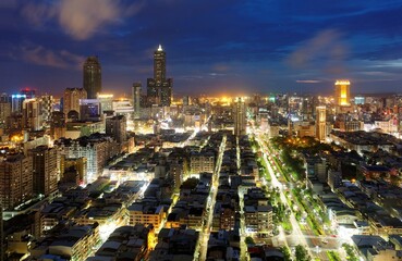 Aerial view of Kaohsiung City at dusk, a vibrant seaport in South Taiwan, with the famous landmark...
