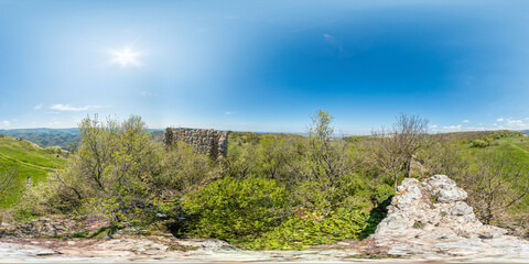 Wide panoramic view on mountain landscape with lush green hills under clear blue sky, tranquil natural beauty, perfect for outdoor enthusiasts. Seamless 360 degree spherical equirectangular panorama.
