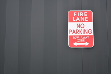 Fire Lane, No Parking, Tow Away Zone sign.