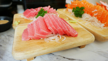 Tuna sashimi with wasabi serve on wooden dish. Japanese food Tuna sashimi and wasabi prepared for eating on table, traditional Japanese food. raw tuna
