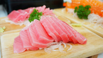 Tuna sashimi with wasabi serve on wooden dish. Japanese food Tuna sashimi and wasabi prepared for eating on table, traditional Japanese food. raw tuna
