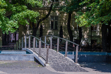 Pedestrian bridge over fountain pool in popular park in Bratislava, Slovakia.