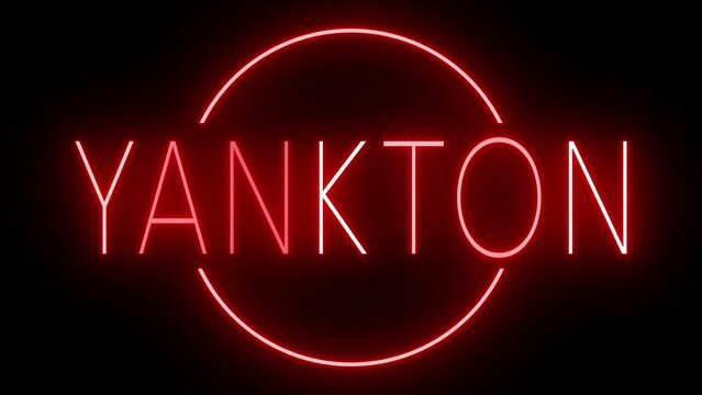 Flickering red retro style neon sign glowing against a black background for YANKTON