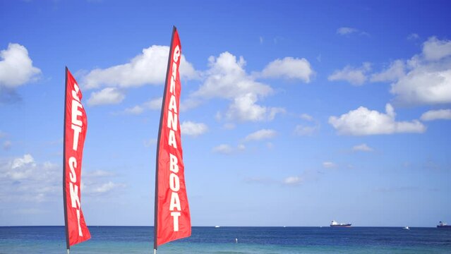Jet Ski and Banana Boat rental signs on the beach. 4k hdr stock video