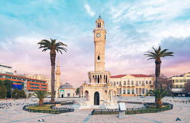 Fototapeta na wymiar Izmir clock tower square and palm tree at sunset- Turkey