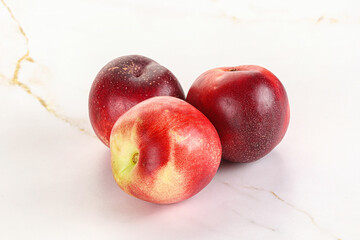 Ripe sweet juicy nectarines heap