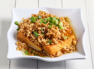 chaipoh tofu topping with spring onion served in dish isolated on table top view of singapore food