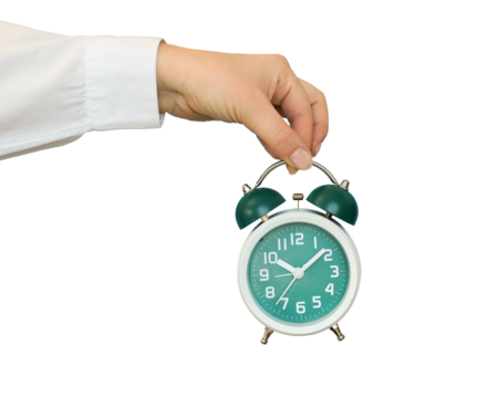 Hand holding a classic alarm clock on transparent background