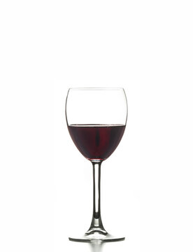 Red wine glass on an isolated background, represents elegance and luxury, perfect for celebrations and parties in a bar or winery setting