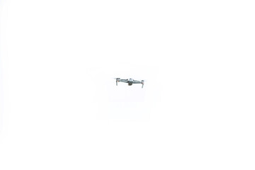 drone is flaying against isolated white background.