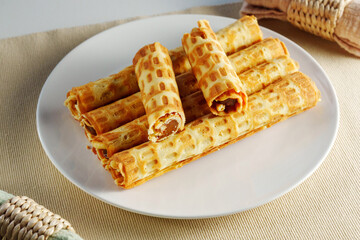 Ethereal Morning Delight: A Gourmet Stack of Golden Waffles on a Crisp White Plate