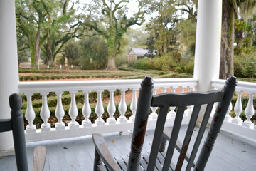 Rocking Chair on Porch at Historic Home - obrazy, fototapety, plakaty
